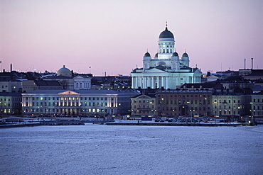 Dusk light on the Lutheran Christian cathedral in winter snow, across the frozen Baltic Sea, Helsinki, Finland, Scandinavia, Europe