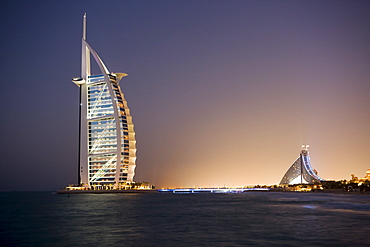 The iconic symbol of Dubai, the Burj Al Arab, the world's first seven star hotel (classified as five star deluxe), built on an artificial island offshore from the Jumeirah Beach Hotel, Dubai, United Arab Emirates, Middle East