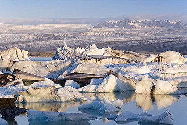 Icebergs floating in the Lagoon beneath Breidamerkurjokull Glacier, Jokulsarlon (Glacial River Lagoon), southern Vatnajokull, southern area, Iceland, Polar Regions