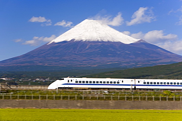 Shinkansen (Bullet train) which reaches speeds of up to 300km per hour passing Mount Fuji, blurred motion, Honshu, Japan, Asia