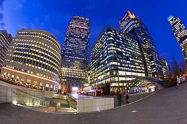 Financial District office buildings illuminated at dusk, Canary Wharf, Docklands, London, England, United Kingdom, Europe