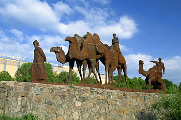 Statues of camels and camel drivers on Silk Road monument near the Registan in Samarkand, Uzbekistan, Central Asia, Asia