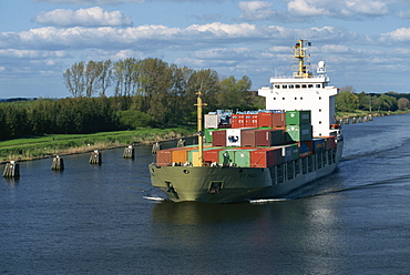 Containers on a ship transitting the Kiel Canal in Germany, Europe