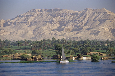 Felucca on the River Nile, looking towards Valley of the Kings, Luxor, Thebes, Egypt, North Africa, Africa