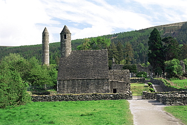 Monastic gateway, round tower dating from 10th to 12th centuries, Glendalough, Wicklow Mountains, County Wicklow, Leinster, Eire (Republic of Ireland), Europe