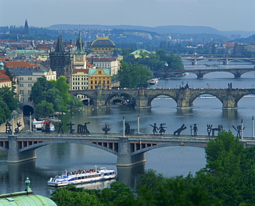 Modern sculpture on the Manesuv Bridge with the Charles Bridge behind, Prague, Czech Republic, Europe