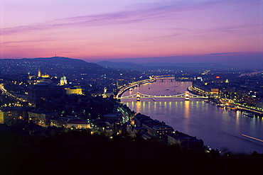 Evening view over city and River Danube, Castle district, Chain Bridge and Parliament, Budapest, Hungary, Europe