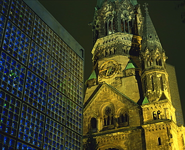 Contrast between the Remembrance Church and the Kaiser Wilhelm Memorial Church, illuminated at night, Kurfurstendam, Berlin, Germany, Europe