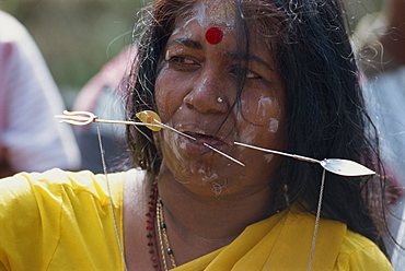 Woman with pierced tongue during the annual Hindu festival of Thaipusam at the Batu Caves near Kuala Lumpur, Malaysia, Southeast Asia, Asia