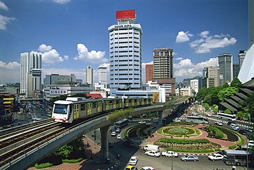 The Light Rail Transit system with the skyline of the city of Kuala Lumpur behind, Malaysia, Southeast Asia, Asia