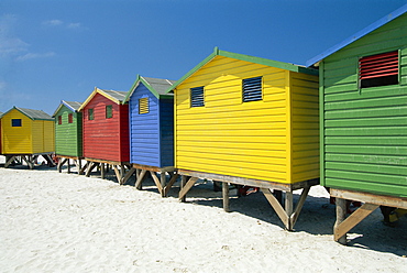 Brightly painted beach bathing huts at False Bay, Muizenburg, Cape Town, South Africa *** Local Caption ***