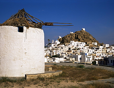 Old windmill and the main town of Hora, Ios, Cyclades, Greek Islands, Greece, Europe