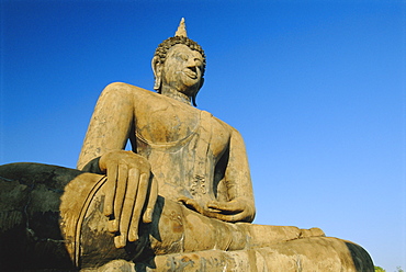 Seated Buddha statue in the Historical Park, old Sukhothai (Muang Kao), Sukhothai, Thailand