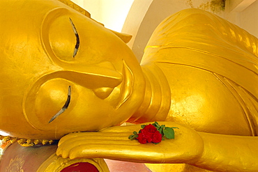 Close up of the head of a reclining Buddha statue, Wat Pha Baat Tai, Luang Prabang, Laos