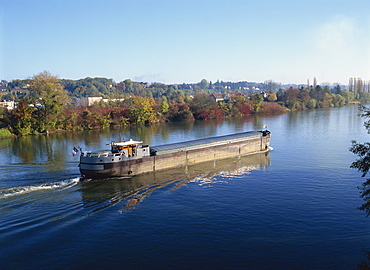 A barge on the River Seine at Bois le Roi, Ile de France, France, Europe