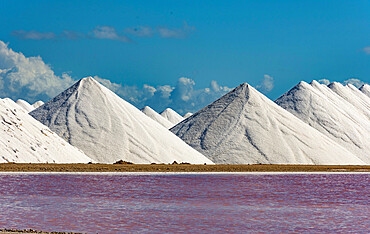 Stacks of salt beside large salt pans, Bonaire, ABC Islands, Dutch Antilles, Caribbean, Central America