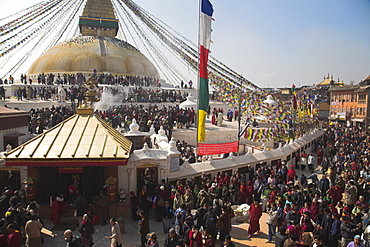 People walking round base of stupa during Lhosar, the Tibetan and Sherpa New Year festival, Bodhnath Buddhist Stupa, UNESCO World Heritage Site, Bagmati, Kathmandu, Nepal, Asia