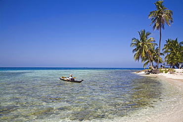 Tourist in sea cayak, Silk Caye, Belize, Central America