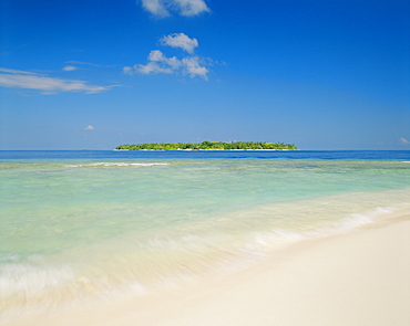 The tropical island of Bandos from Kuda Bandos (Little Bandos), North Male Atoll, the Maldives, Indian Ocean