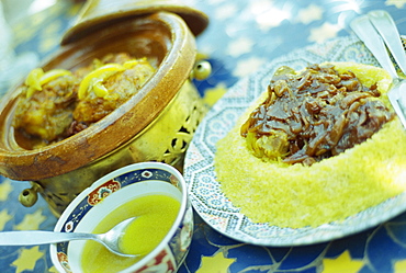 Traditional food of chicken tagine, and lamb with cous cous, Marrakech, Morocco, North Africa, Africa