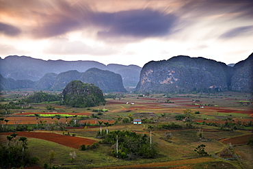 Dusk view across Vinales Valley showing limestone hills known as Mogotes, Vinales, UNESCO World Heritage Site, Cuba, West Indies, Central America