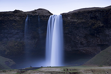 Seljalandsfoss Waterfall captured at dusk using long exposure to record movement in the water, near Hella, southern area, Iceland, Polar Regions