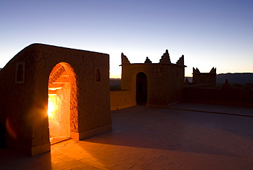 Roof terrace at dawn on a kasbah in the town of Nkob, with light glowing from the staircase, Nkob, Morocco, North Africa, Africa