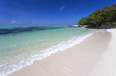 Idyllic beach scene with blue sky, aquamarine sea and soft sand, Ile Aux Cerfs, Mauritius, Indian Ocean, Africa