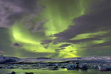 The Aurora Borealis (Northern Lights) captured in the night sky over Jokulsarlon glacial lagoon on the edge of the Vatnajokull National Park, during winter, South Iceland, Iceland, Polar Regions