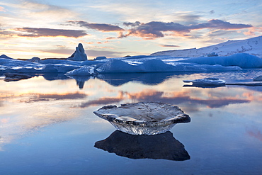 Winter sunset over Jokulsarlon, a glacial lagoon at the head of the Breidamerkurjokull Glacier on the edge of the Vatnajokull National Park, South Iceland, Iceland, Polar Regions