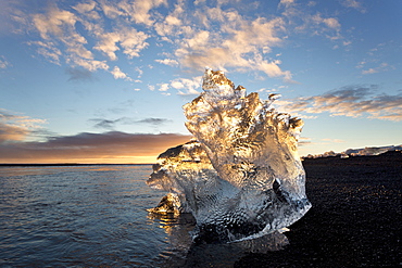 Icebergs at sunset on Jokulsa Beach, on the edge of the Vatnajokull National Park, South Iceland, Iceland, Polar Regions