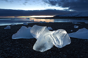 Icebergs at sunset on Jokulsa Beach, on the edge of the Vatnajokull National Park, South Iceland, Iceland, Polar Regions