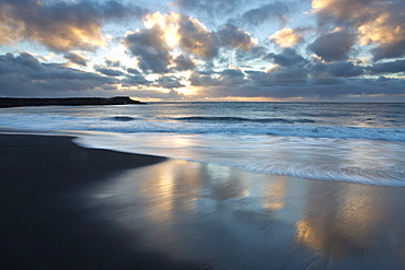 Looking out towards the North Atlantic at sunrise from the black volcanic sand beach at Vik i Myrdal, South Iceland, Iceland, Polar Regions