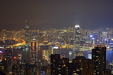 View at night of central Hong Kong and Victoria Harbour from Victoria Peak, looking toward Kowloon in background, Hong Kong, China, Asia