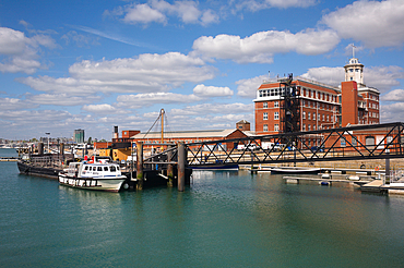 Portsmouth Harbour with moored Jenny R waterbus and naval headquarters building
