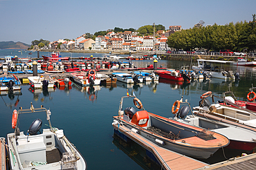 Moored boats on pontoons at marina at harbour of Vilagarcia de Arousa in Galicia Spain