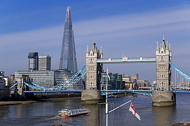 The Shard and Tower Bridge standing tall above the River Thames with RN flags in foreground, London, England, United Kingdom, Europe