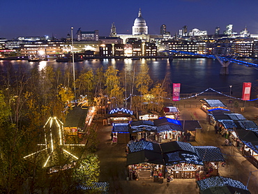 Christmas market with St. Pauls and Millennium Bridge, with City skyline dusk, London, England, United Kingdom, Europe 