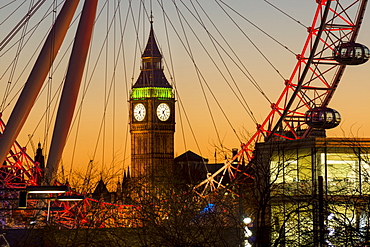 London Eye (Millennium Wheel) frames Big Ben at sunset, London, England, United Kingdom, Europe