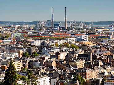 City skyline towards Seine estuary showing iconic twin chimneys, Le Havre, Normandy, France, Europe