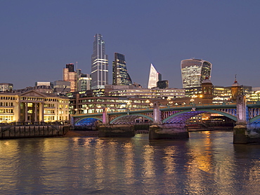 Cityscape with complete 22 Bishopsgate Tower and Southwark Bridge at dusk, London, England, United Kingdom, Europe