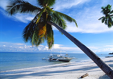 Outrigger Motorboat Moored on Alona Beach, Panglao, Bohol, Philippines