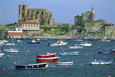 Boats moored in harbour and the 12th century church of Santa Maria, Castro Urdiales, Cantabria, Spain, Europe