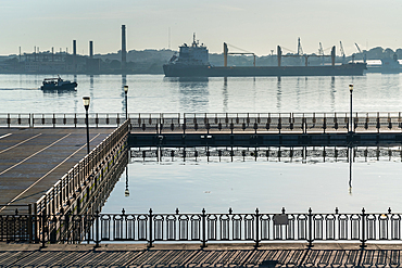 Symmetrical patterns of railings, a boat, a ship and cranes at Havana Harbour, Havana, Cuba