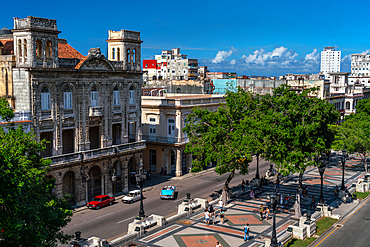 Paseo del Prado: aerial view with promenaders and blue classic car full of tourists, Havana, Cuba