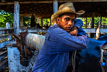 Cowboy with his horse (close up) at a farm near Trinidad, Cuba 3 (Model Release)