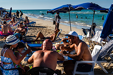 Crowded and buzzing public beach, Playas del Este, near Havana, Cuba 1