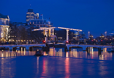 The Magere Bridge at night, also known as the Skinny Bridge, Amstel River, Amsterdam, Netherlands, Europe