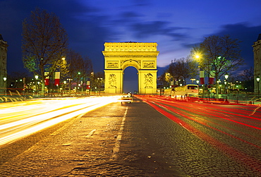 Arc de Triomphe illuminated at dusk, Paris, France, Europe