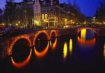 Illuminated Bridges Reflected in the Canals at Night, Keizersgracht, Amsterdam, Netherlands